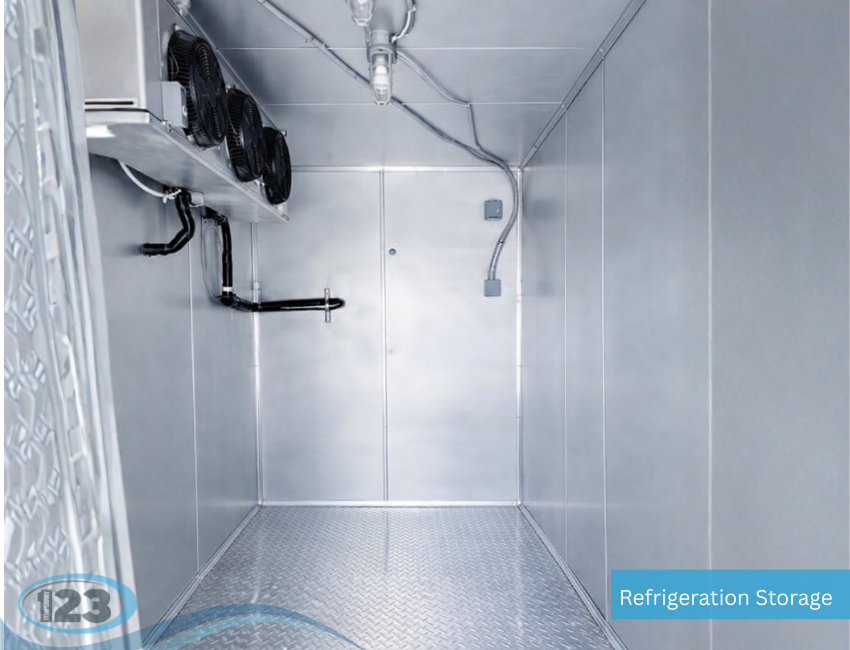 Interior of a refrigerated trailer rental featuring insulated walls, aluminum diamond plate flooring, and commercial cooling evaporator fans for temperature controlled cold storage.