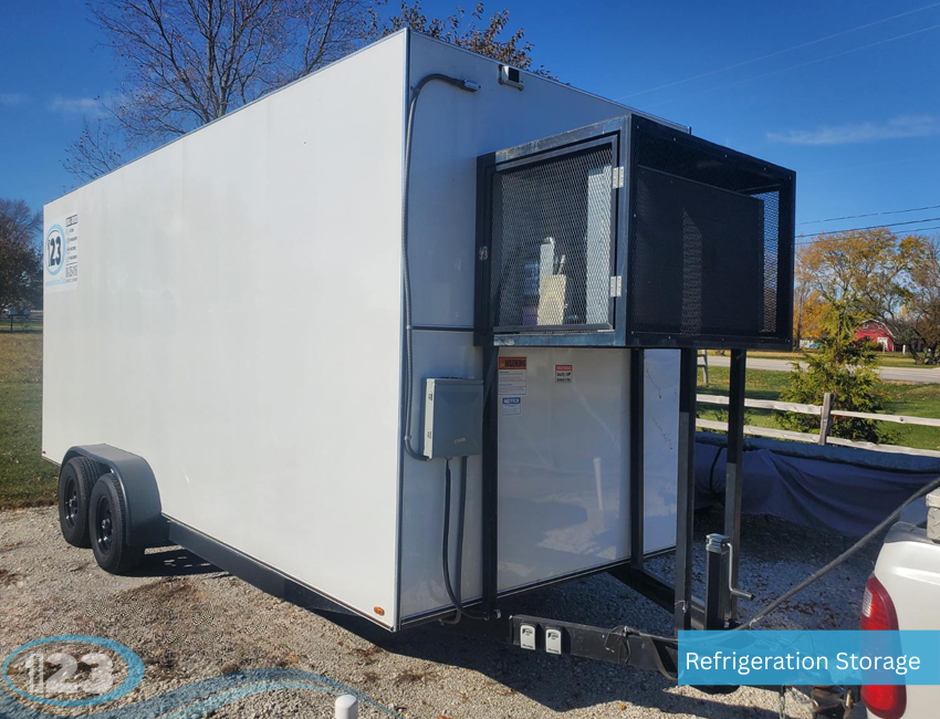 Mobile refrigerated trailer with external cooling unit and power hookup parked outdoors for cold storage rental